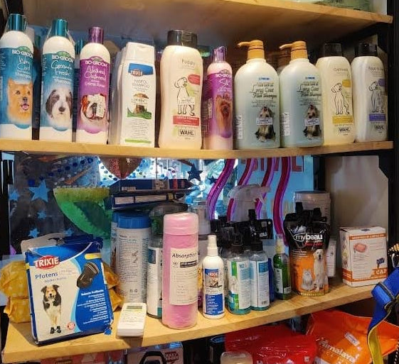 Shelf with various bottles and containers in a store setting